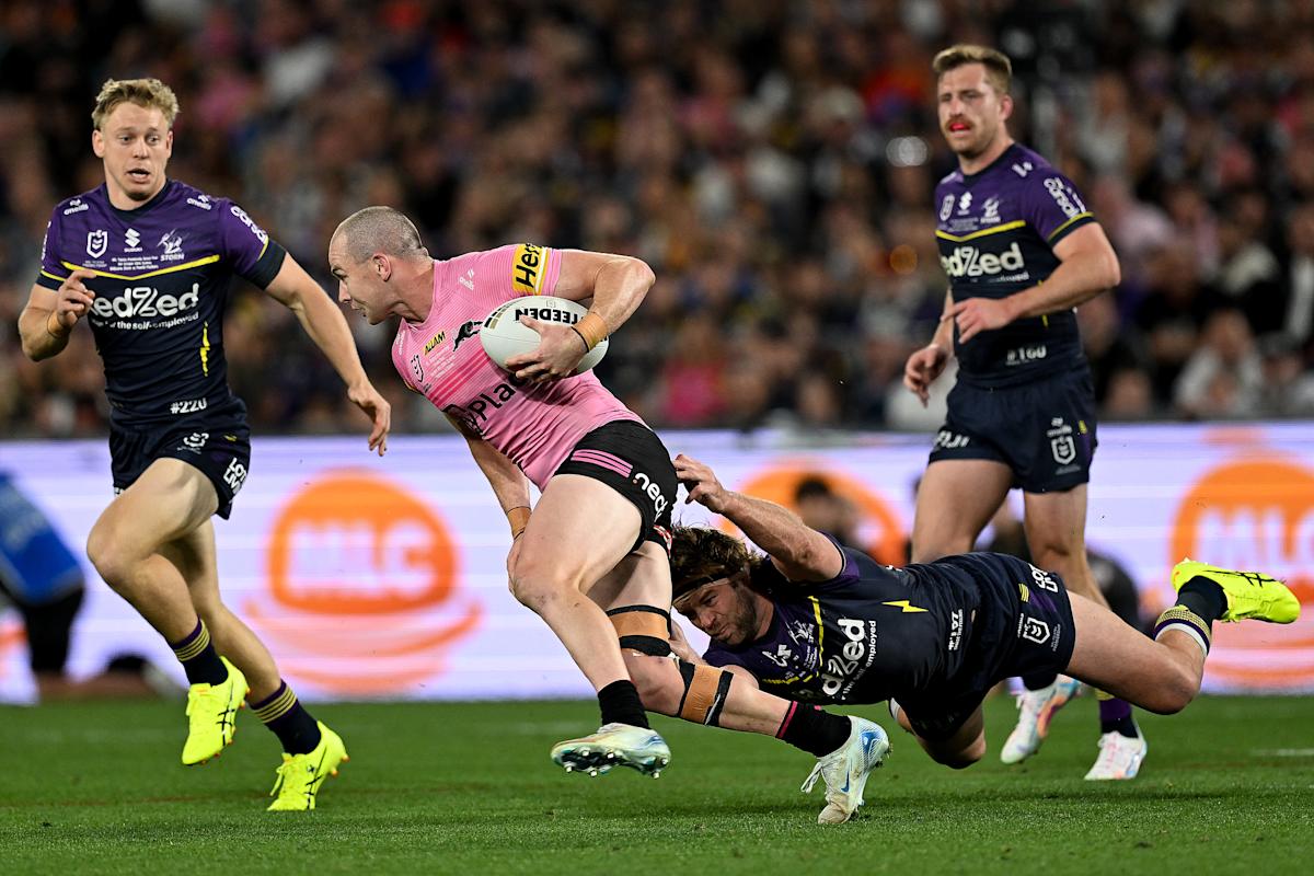 Penrith Panthers' Dylan Edwards (2nd L) is tackled during the National Rugby League (NRL) Grand Final match between Melbourne Storm and Penrith Panthers at Accor Stadium in Sydney on October 6, 2024. (Photo by Izhar KHAN / AFP) / -- IMAGE RESTRICTED TO EDITORIAL USE - STRICTLY NO COMMERCIAL USE -- (Photo by IZHAR KHAN/AFP via Getty Images)