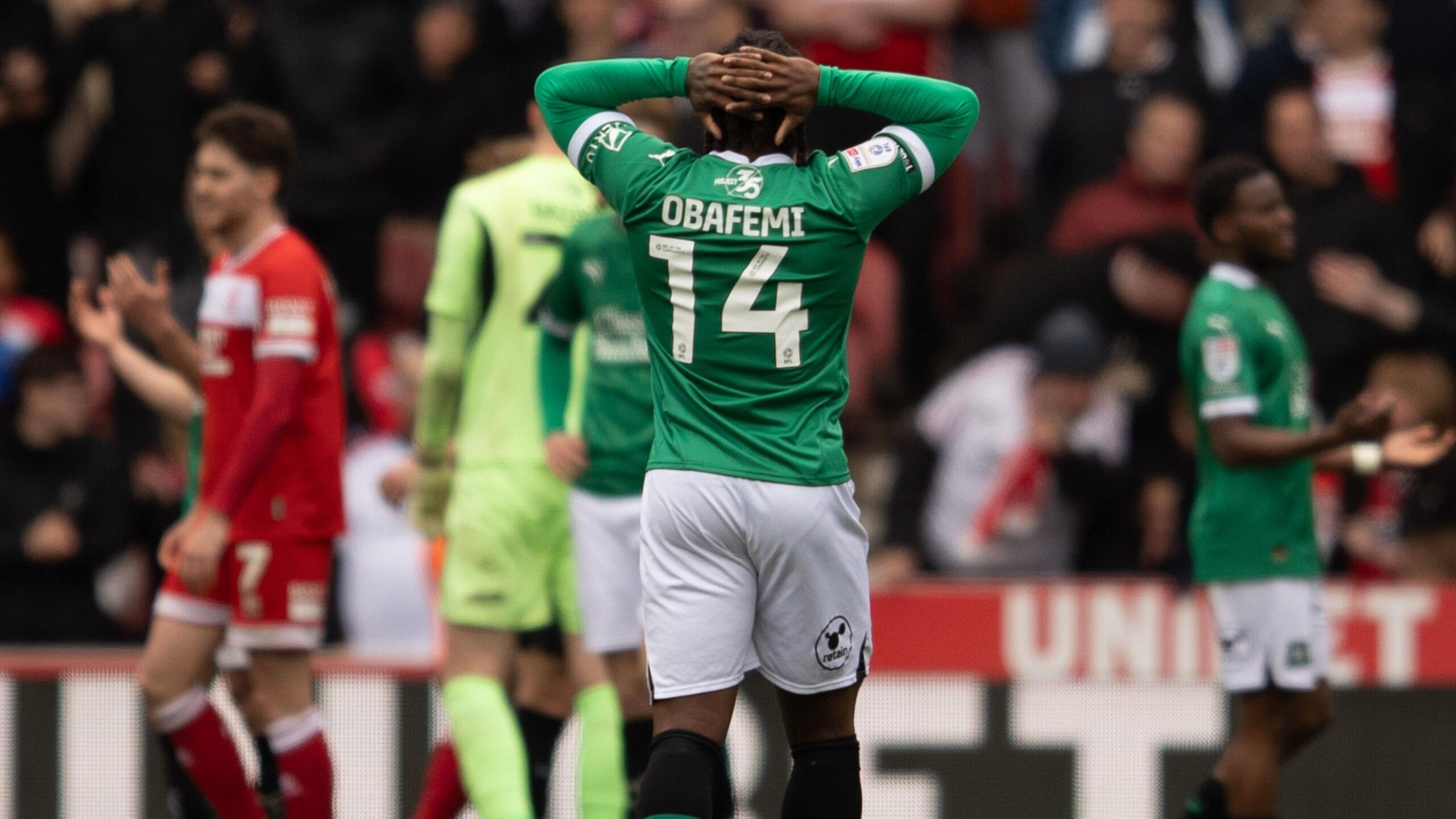 Michael Obafemi holds his head in his hands
