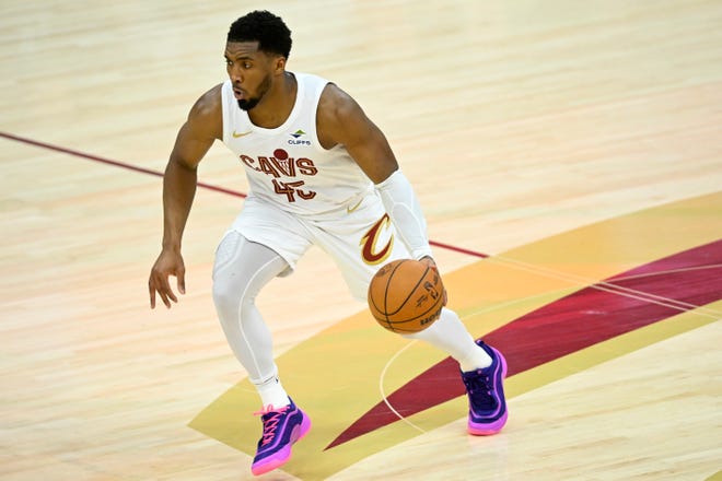 Cleveland Cavaliers guard Donovan Mitchell (45) brings the ball up court against the Miami Heat on April 20, 2025, in Cleveland, Ohio.