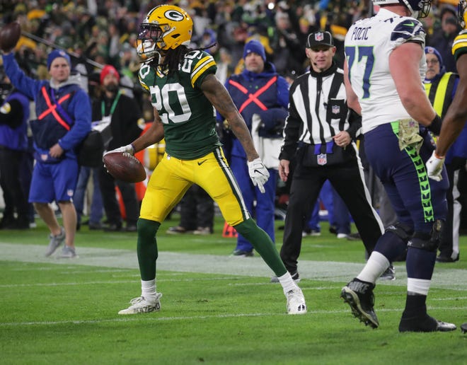Green Bay Packers cornerback Kevin King celebrates an interception in the end zone intended for Seattle Seahawks wide receiver DK Metcalf.