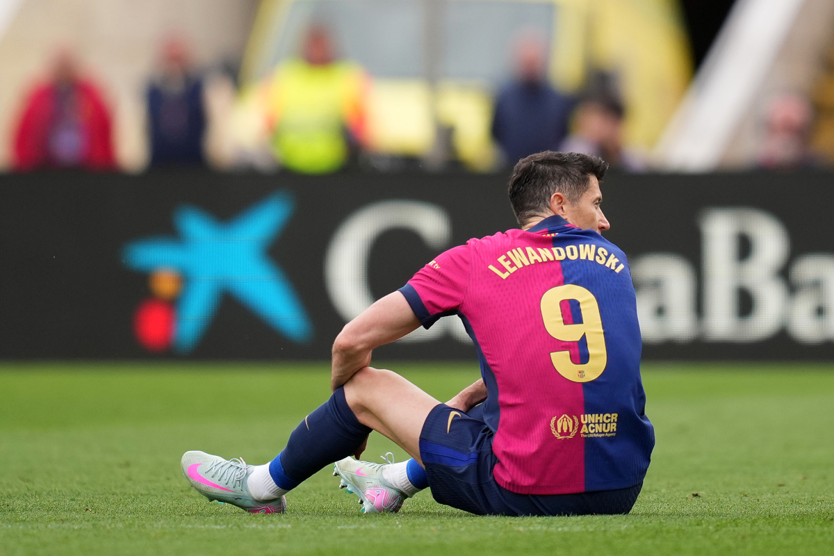 BARCELONA, SPAIN - APRIL 19: Robert Lewandowski of FC Barcelona goes down with an injury during the La Liga match between FC Barcelona and RC Celta de Vigo at Estadi Olimpic Lluis Companys on April 19, 2025 in Barcelona, Spain. (Photo by Alex Caparros/Getty Images)