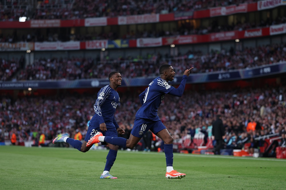 LONDON, ENGLAND: Ousmane Dembele (r) of Paris Saint-Germain celebrates scoring his team's first goal alongside Nuno Mendes during the UEFA Champions League 2024/25 Semi Final First Leg match between Arsenal FC and Paris Saint-Germain at Emirates Stadium on April 29, 2025. (Photo by Michael Steele/Getty Images)