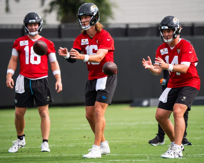 Jacksonville Jaguars quarterback John Wolford (18) watches as Jacksonville Jaguars quarterback Trevor Lawrence (16) and Jacksonville Jaguars quarterback Nick Mullens (14) take a snaps during the Jacksonville Jaguars’ mandatory minicamp Tuesday June 10, 2025 at the Miller Electric Center in Jacksonville, Fla. [Doug Engle/Florida Times-Union]