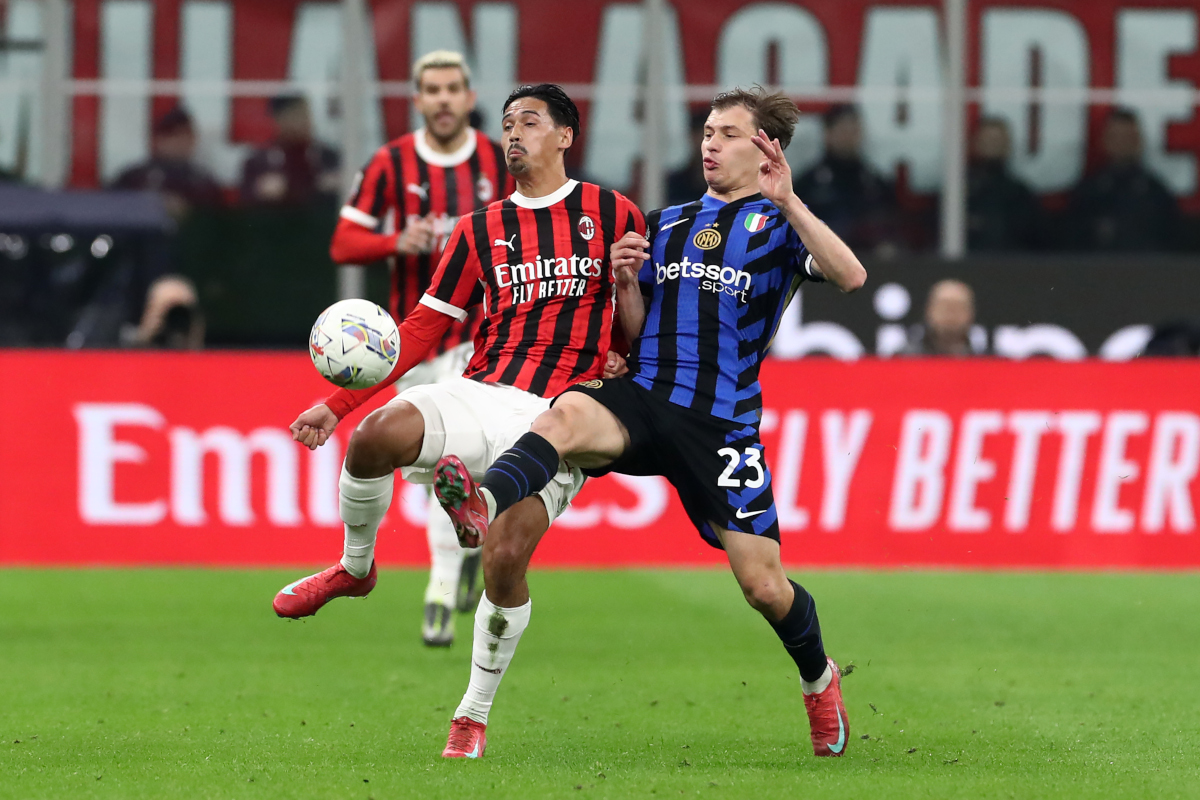 MILAN, ITALY - APRIL 02: Tijjani Reijnders of AC Milan is tackled by Nicolo Barella of FC Internazionale during the Coppa Italia Semi Final match between AC Milan and FC Internazionale at Stadio Giuseppe Meazza on April 02, 2025 in Milan, Italy. (Photo by Marco Luzzani/Getty Images)