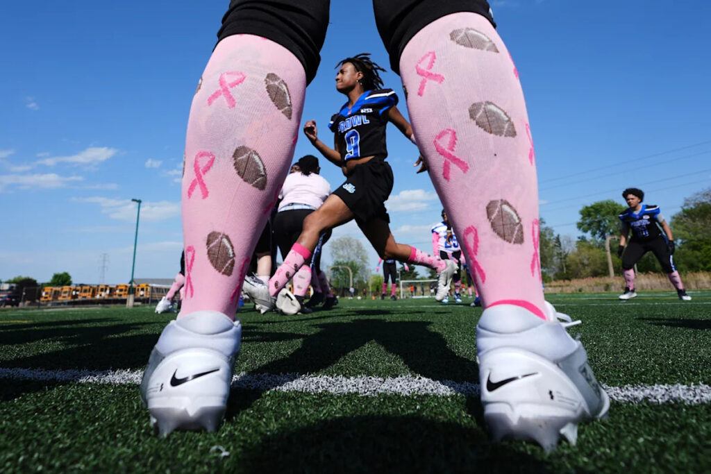Photos of women’s tackle football show opportunities for female athletes in a game dominated by men