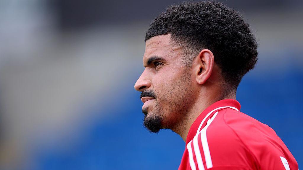 Morgan Gibbs-White looks on