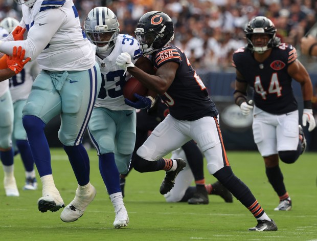 Chicago Bears cornerback Tyrique Stevenson (29) strips the ball from...